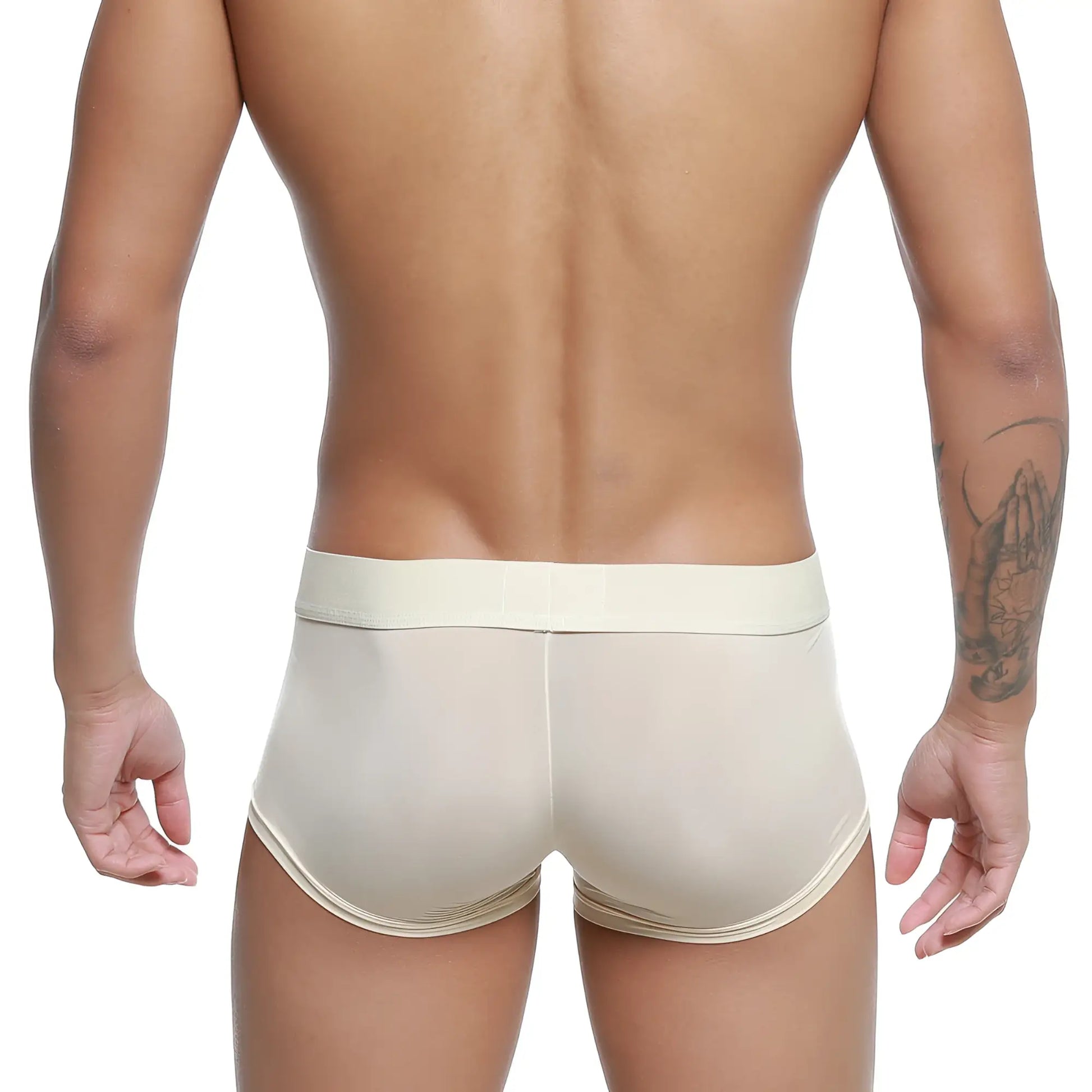 Cream-colored MetroMaleWear form-fitting men’s trunks in smooth, stretchy fabric with a matching waistband.