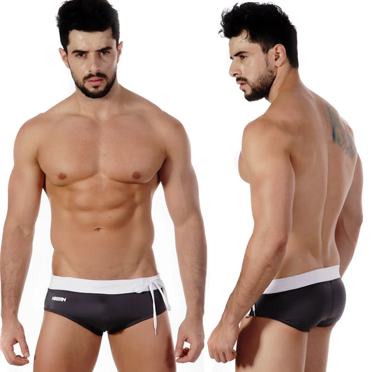 Black swim trunks with white waistband and drawstring featuring a subtle logo side print metroMalewear pearl swim brief