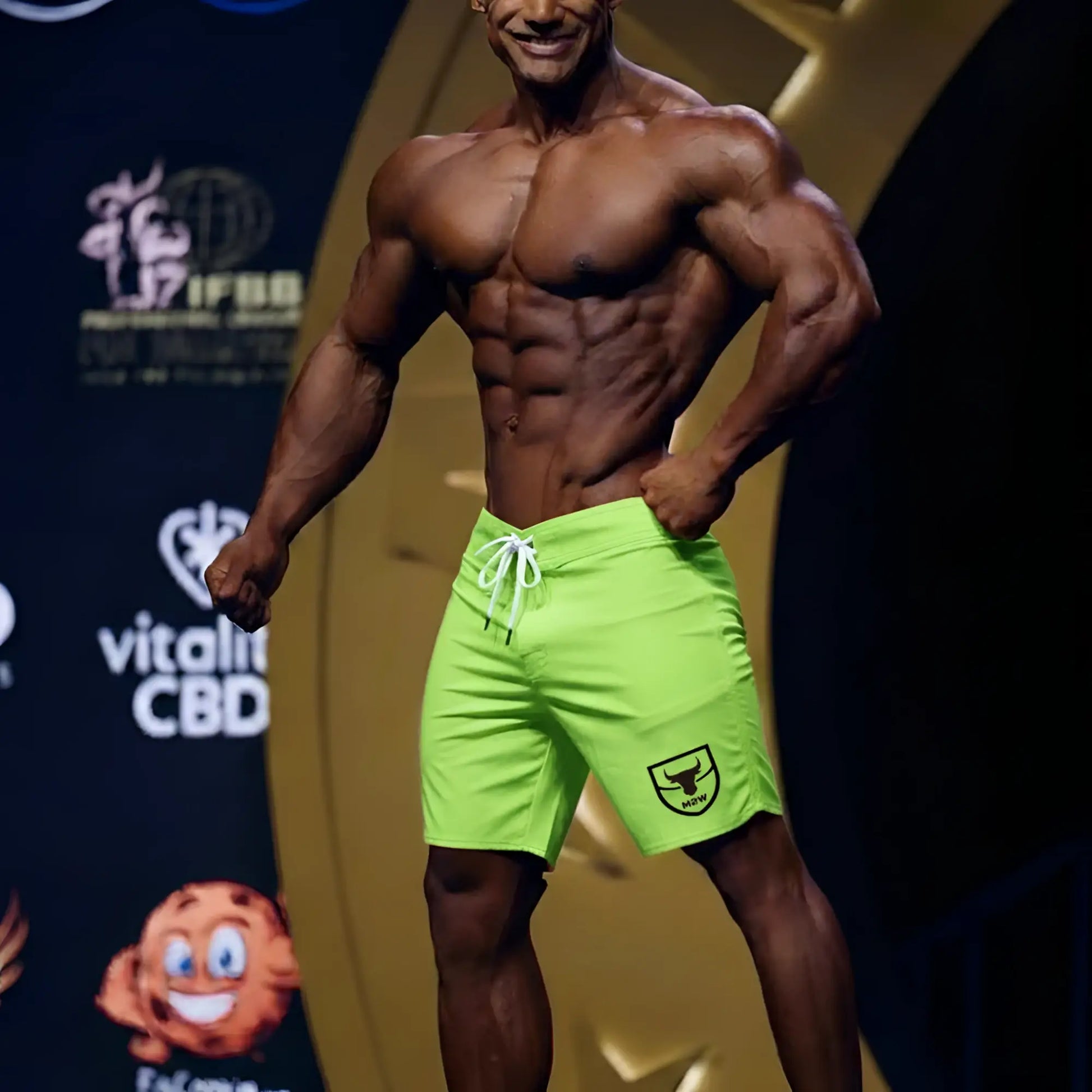 MetroMaleWear physique board short neon green with white drawstring and black shield logo on lower right leg