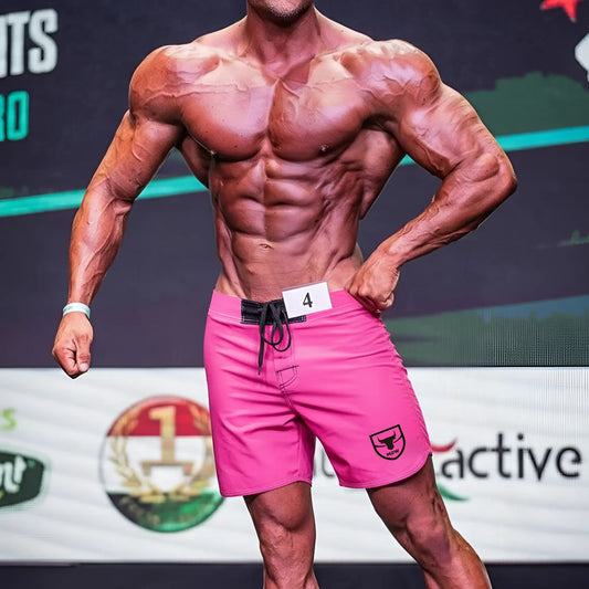 MetroMaleWear physique board short pink 4706-01 with bright pink fabric black drawstring and shield logo on lower right leg