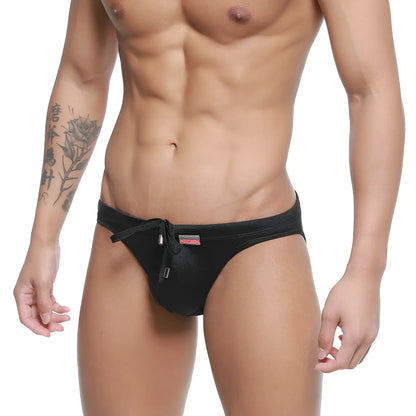 MetroMalewear vanguard swim bikini black satin swim trunks with drawstring waistband and small red logo on the side