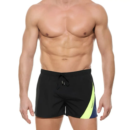 MetroMaleWear Viena short black swim trunks with vibrant neon yellow and navy blue diagonal side stripe