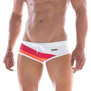 MetroMaleWear wave swim brief white 4918-00 featuring white fabric with a vibrant red orange yellow striped waistband