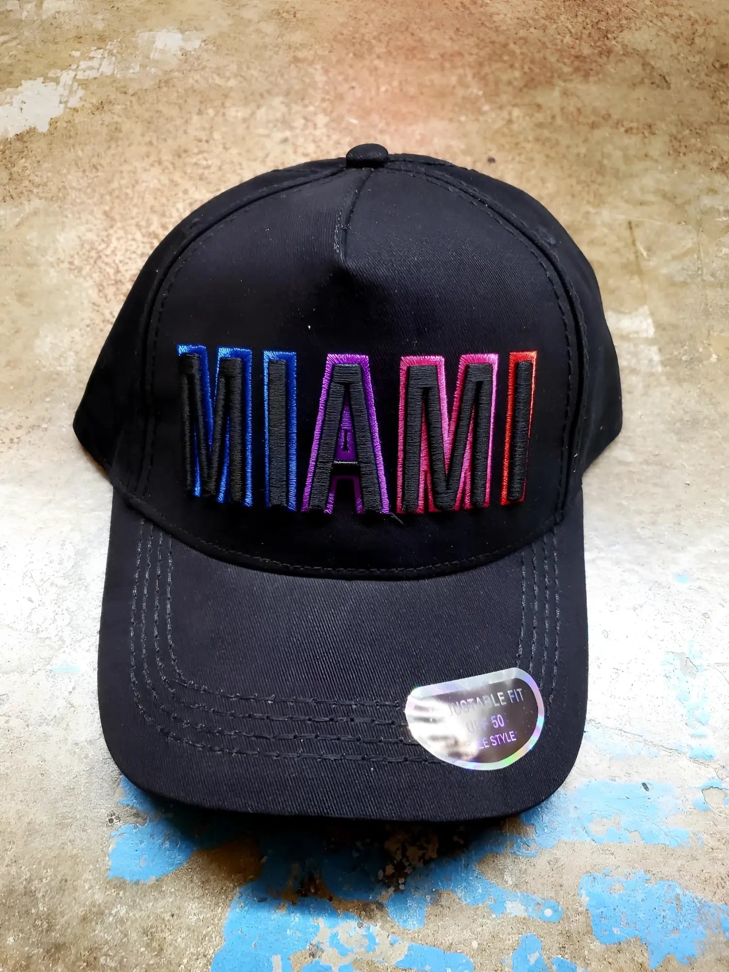 Black miami baseball cap with gradient rainbow embroidered logo on front ideal for casual wear