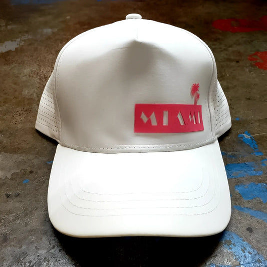 White trucker miami baseball cap with red rectangular patch and palm tree silhouette for casual wear
