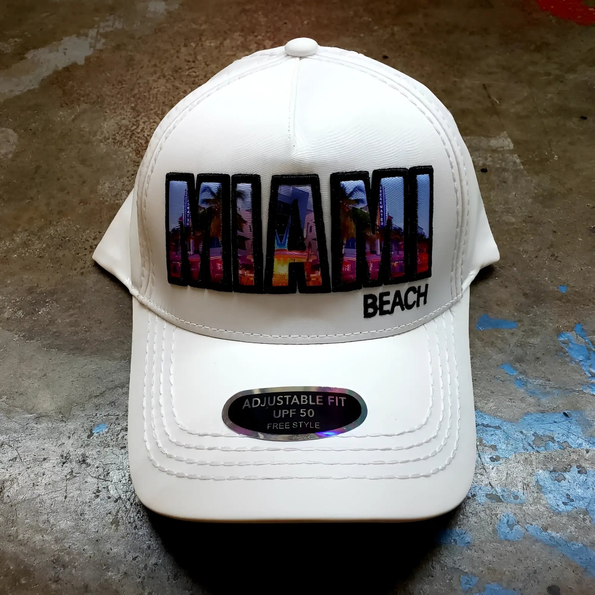 White baseball cap with vibrant colorful miami beach patch and urban skyline design with black trim