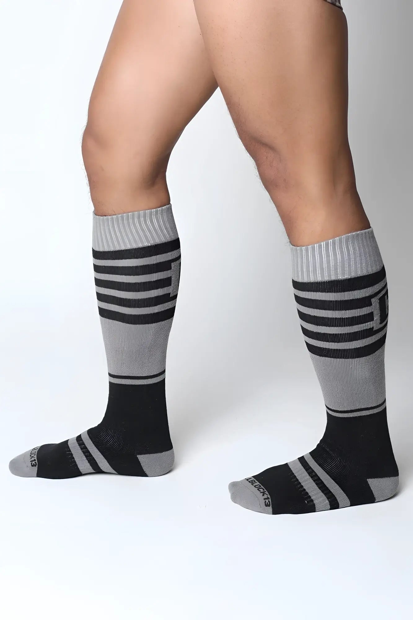 Midfield knee high socks in black and gray stripes with ribbed cuff made for comfortable all-day wear