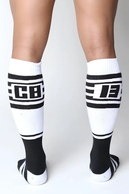 Black and white knee high socks with bold stripes and cb logo from the Midfield collection available in 7 colors