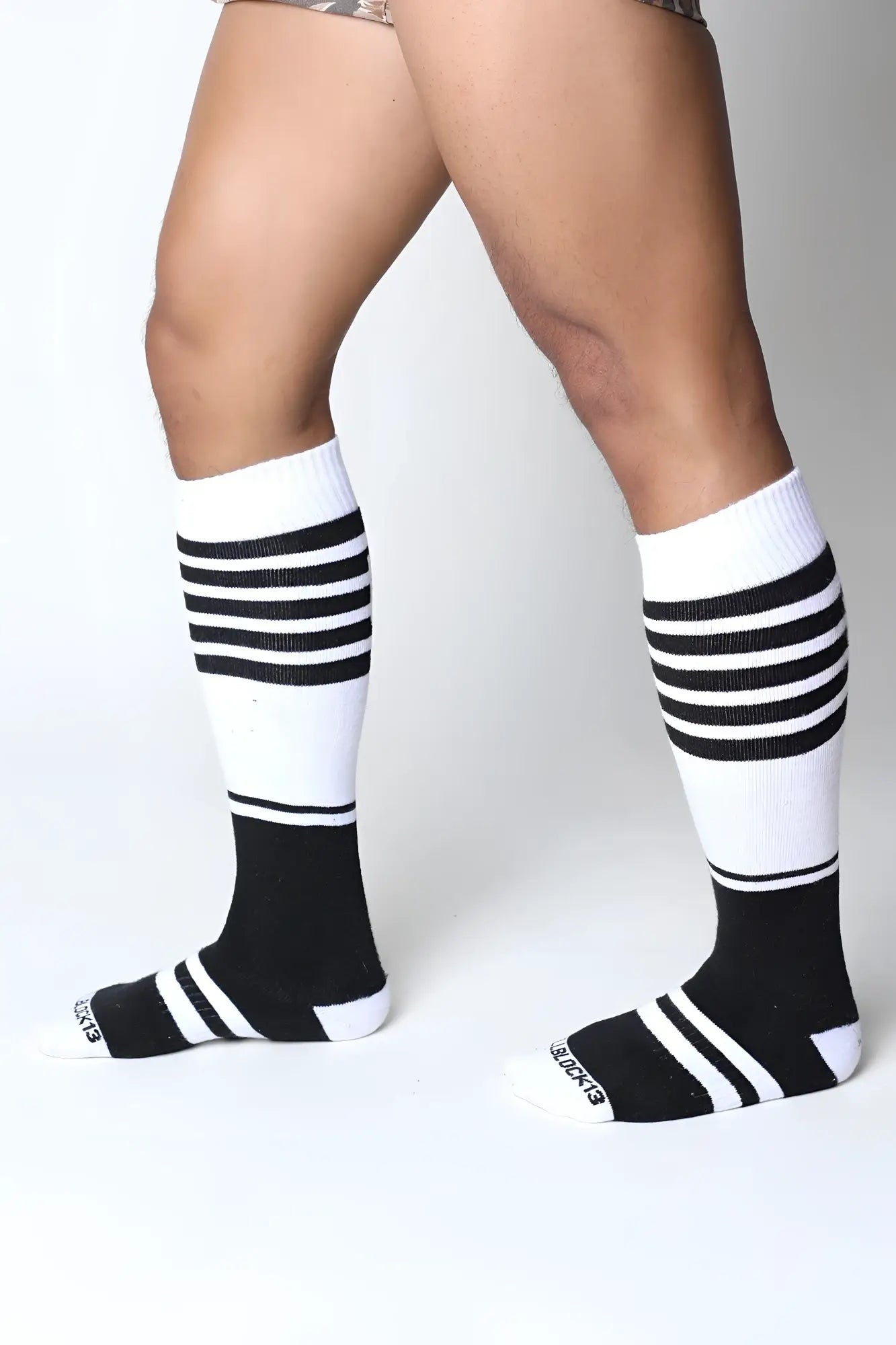 Black and white striped midfield knee high socks with ribbed texture in soft breathable fabric