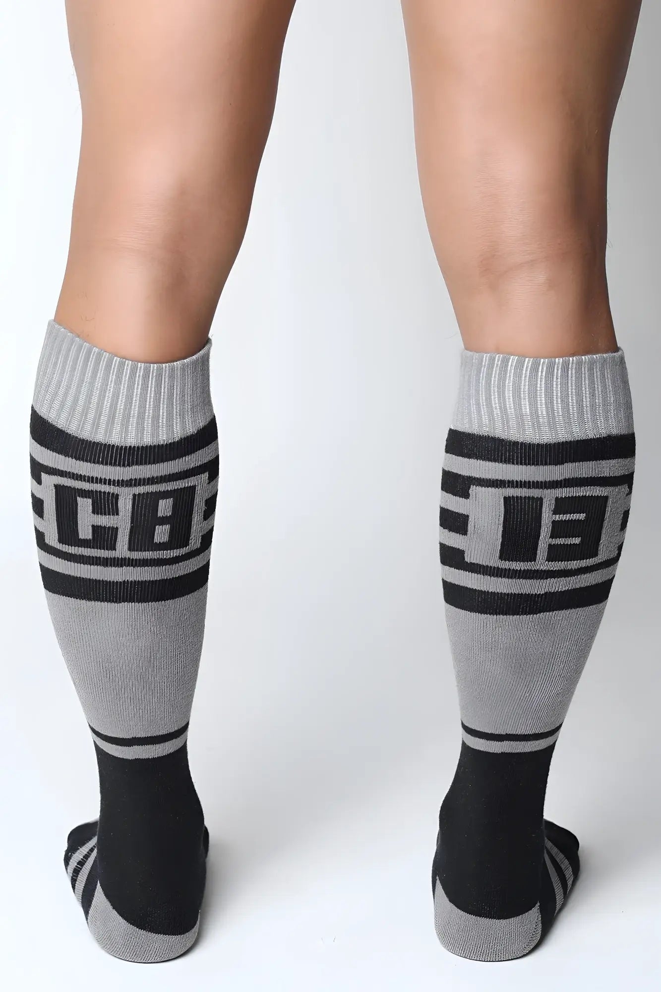 Midfield knee high socks in gray and black with bold cb lettering ribbed cuffs and toe accents
