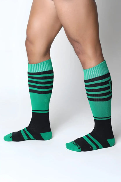 Midfield knee high sock in green and black stripes with ribbed cuffs for comfortable all-day wear