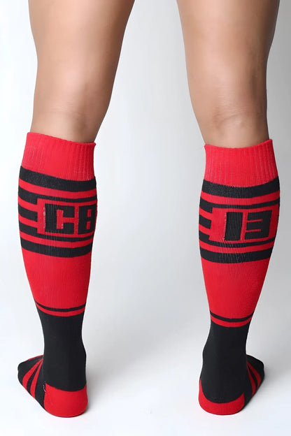 Midfield knee high socks in red and black with bold stripes and a cb logo on the calf in 7 colors