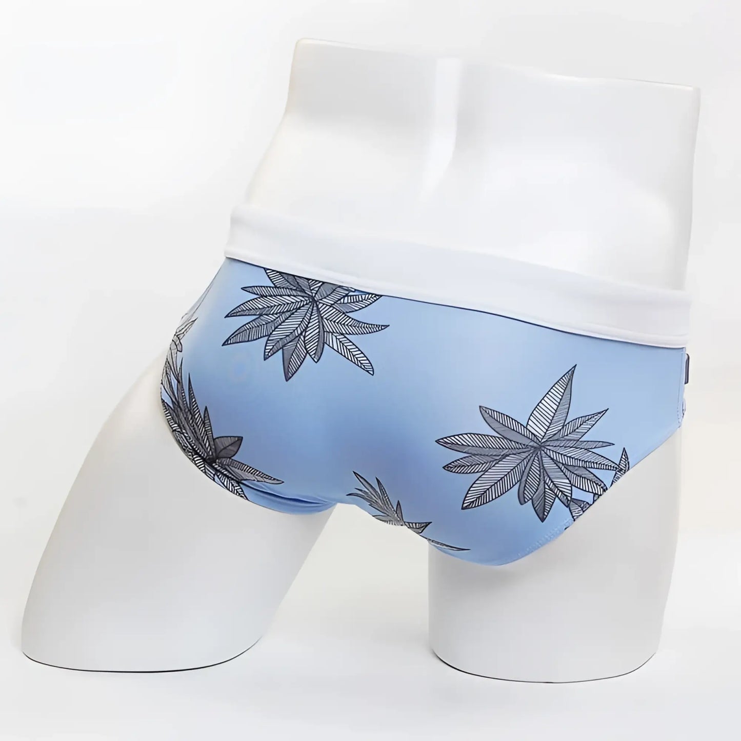 Light blue MIIW floral beach bikini swimwear briefs with white waistband and black and gray cannabis leaf pattern size S