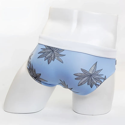 Light blue MIIW floral beach bikini swimwear briefs with white waistband and black and gray cannabis leaf pattern size S