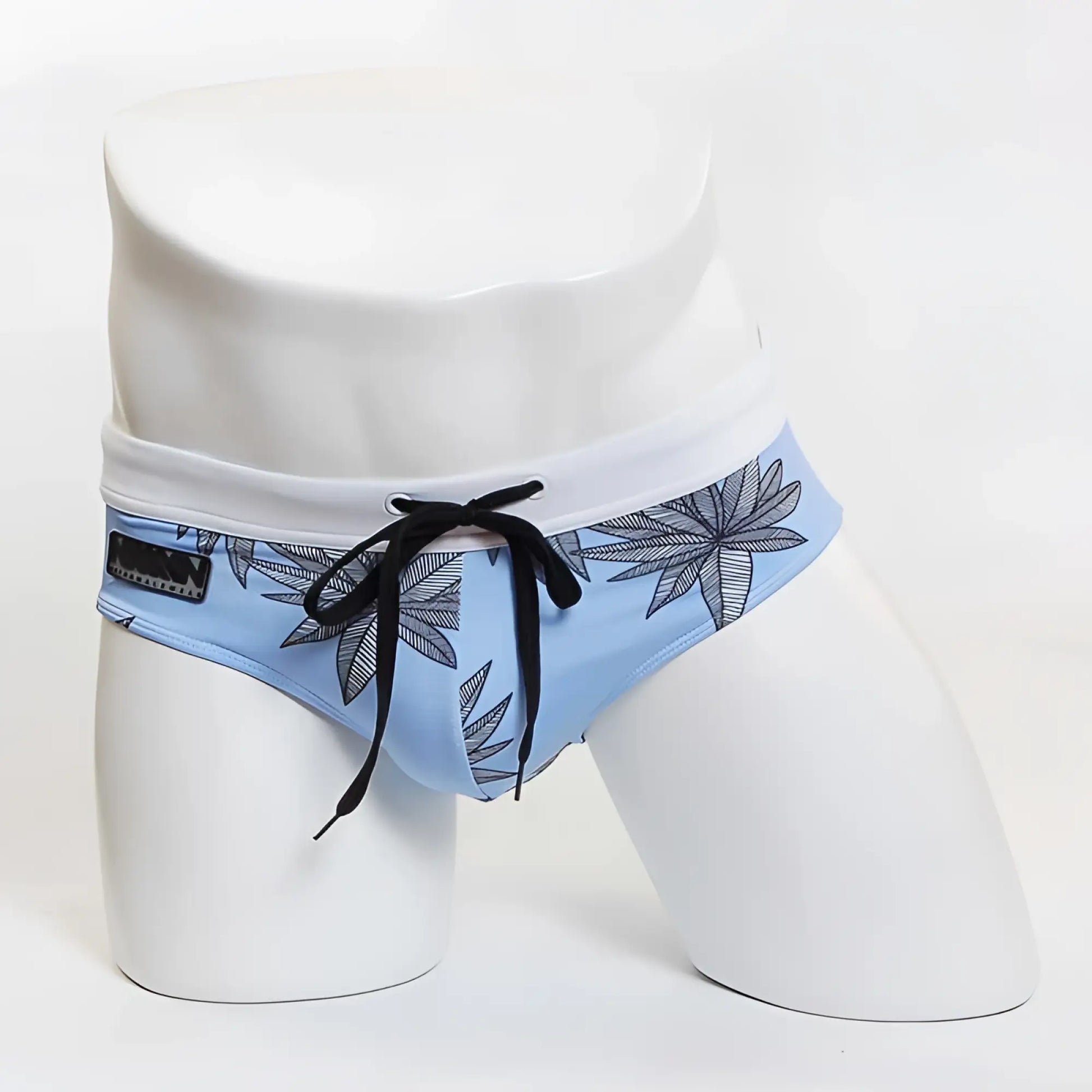 Light blue MIIW floral beach bikini swimwear with black leaf pattern white waistband and black drawstrings size S