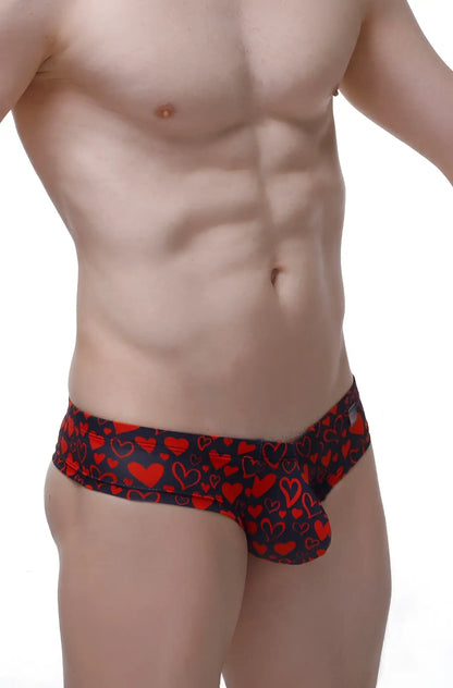 Black mini boxer briefs with a vibrant red heart pattern designed for comfortable everyday wear