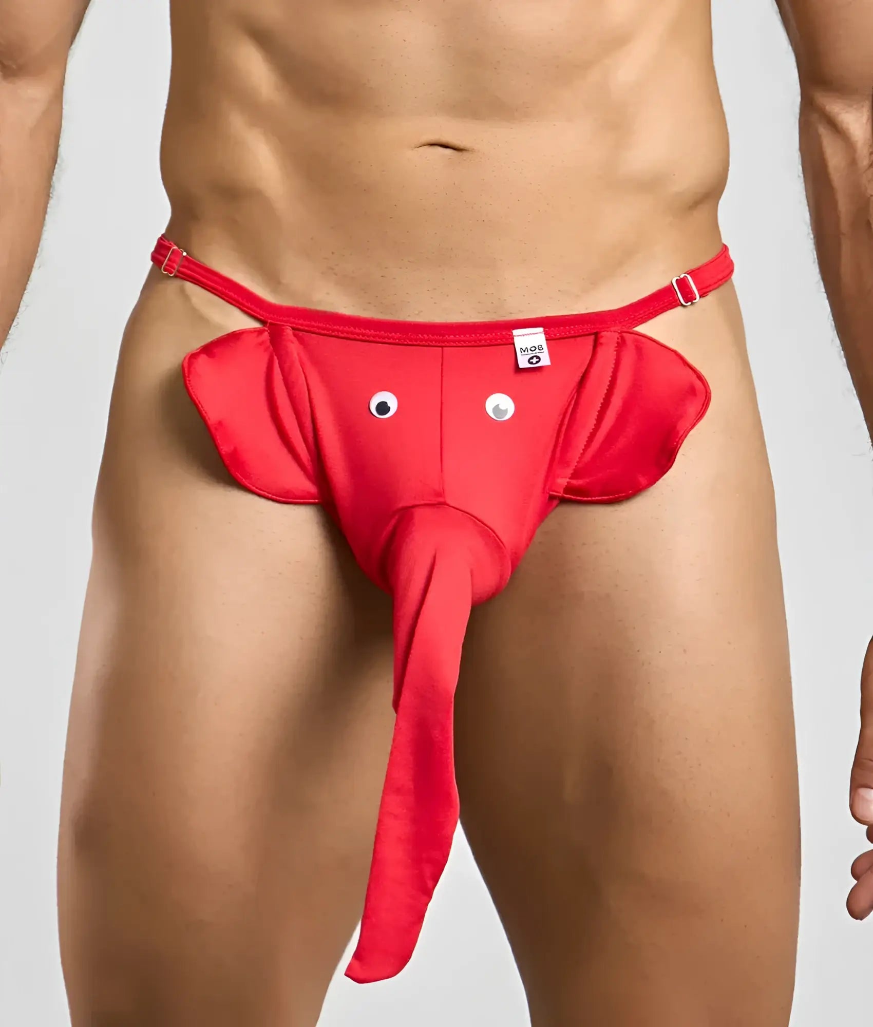 Red elephant thong with googly eyes and long trunk made of stretchy fabric for playful wear