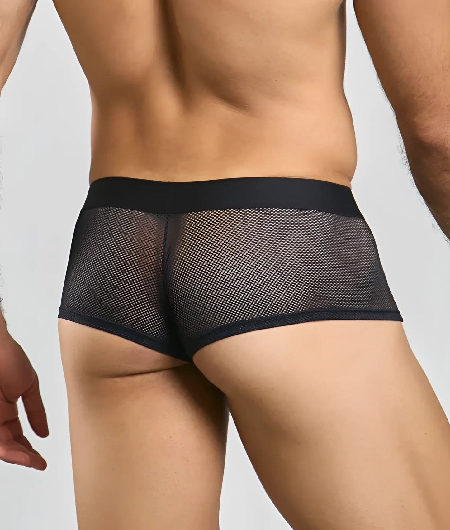 Black mesh briefs with a solid black waistband featuring a fishnet design in the front for breathable comfort