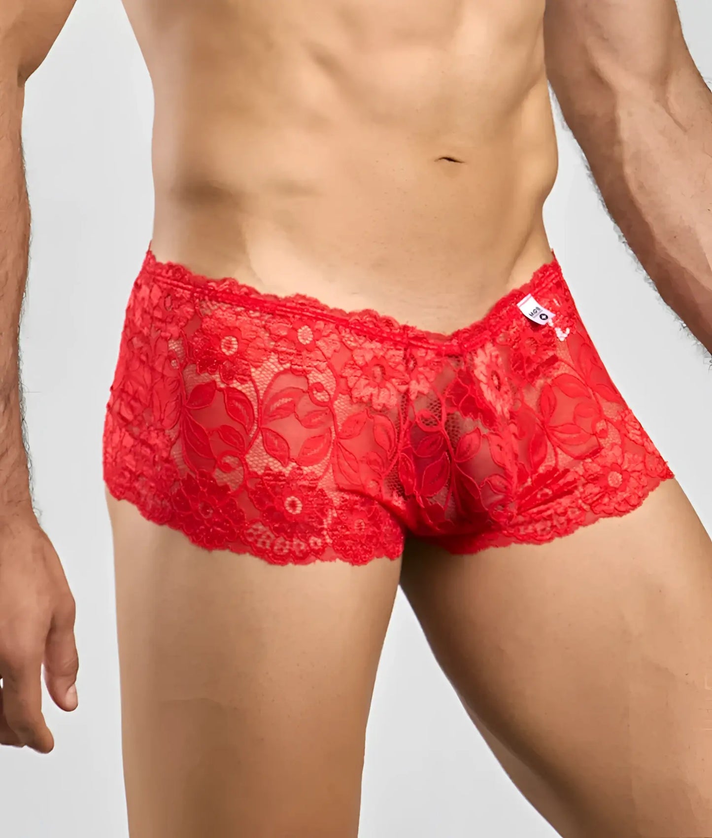 Red lace men’s boxer shorts with floral pattern and scalloped edges in vibrant rose color