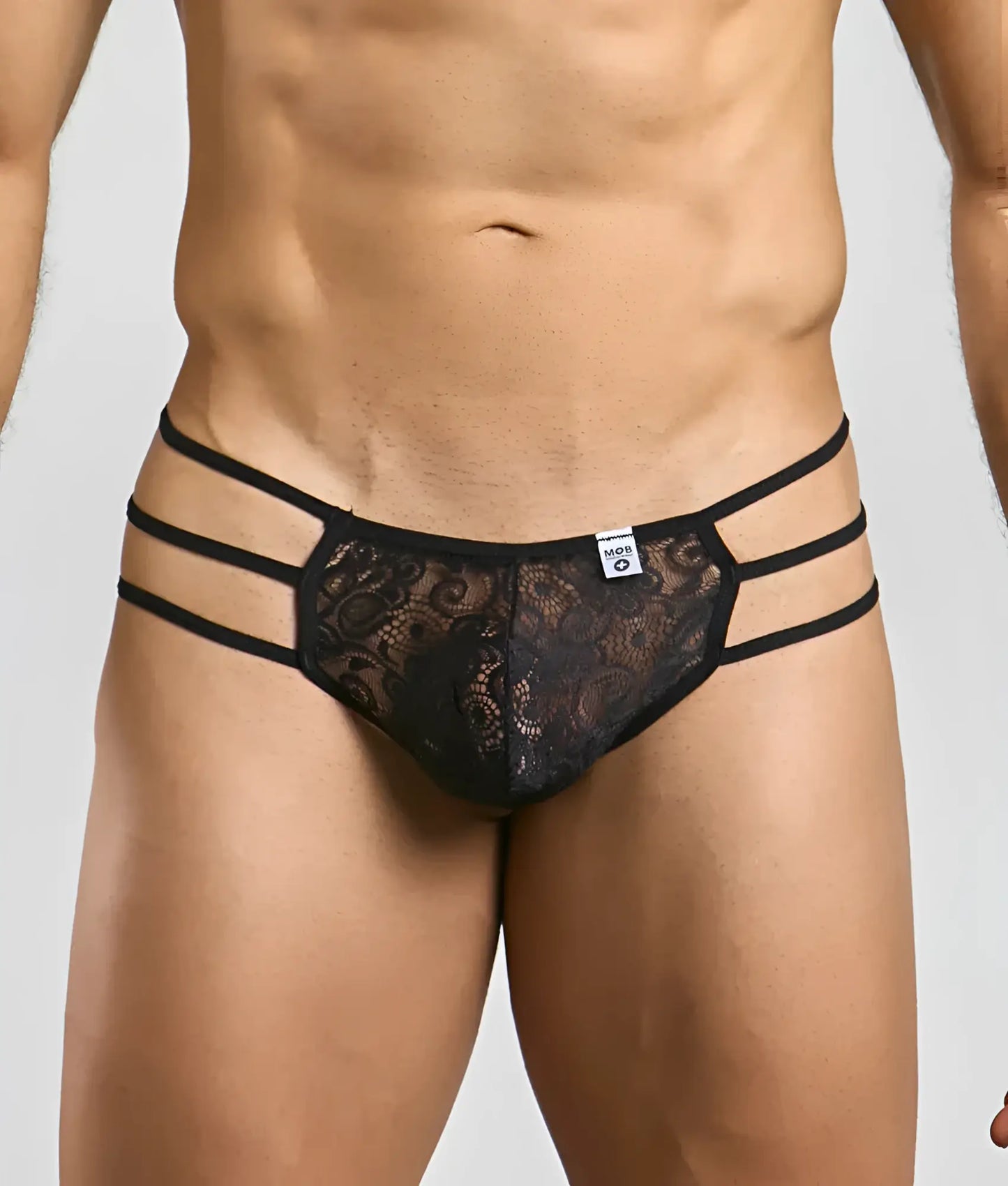 Mob men’s lace pouch thong in black lace with three horizontal elastic straps front view