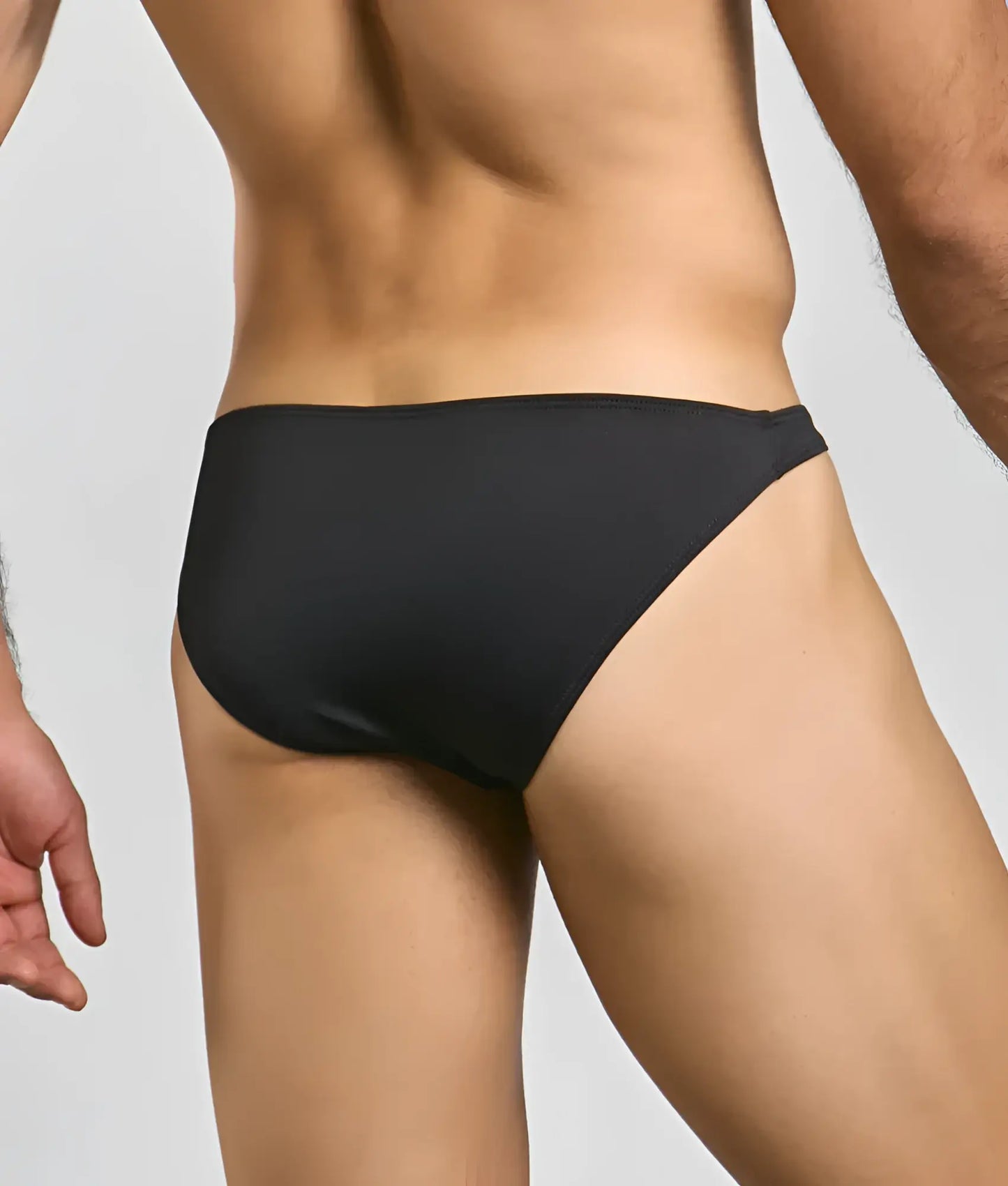 Toucan bikini for men black sleek form-fitting swim trunks with smooth fabric finish designed for swimming and beachwear