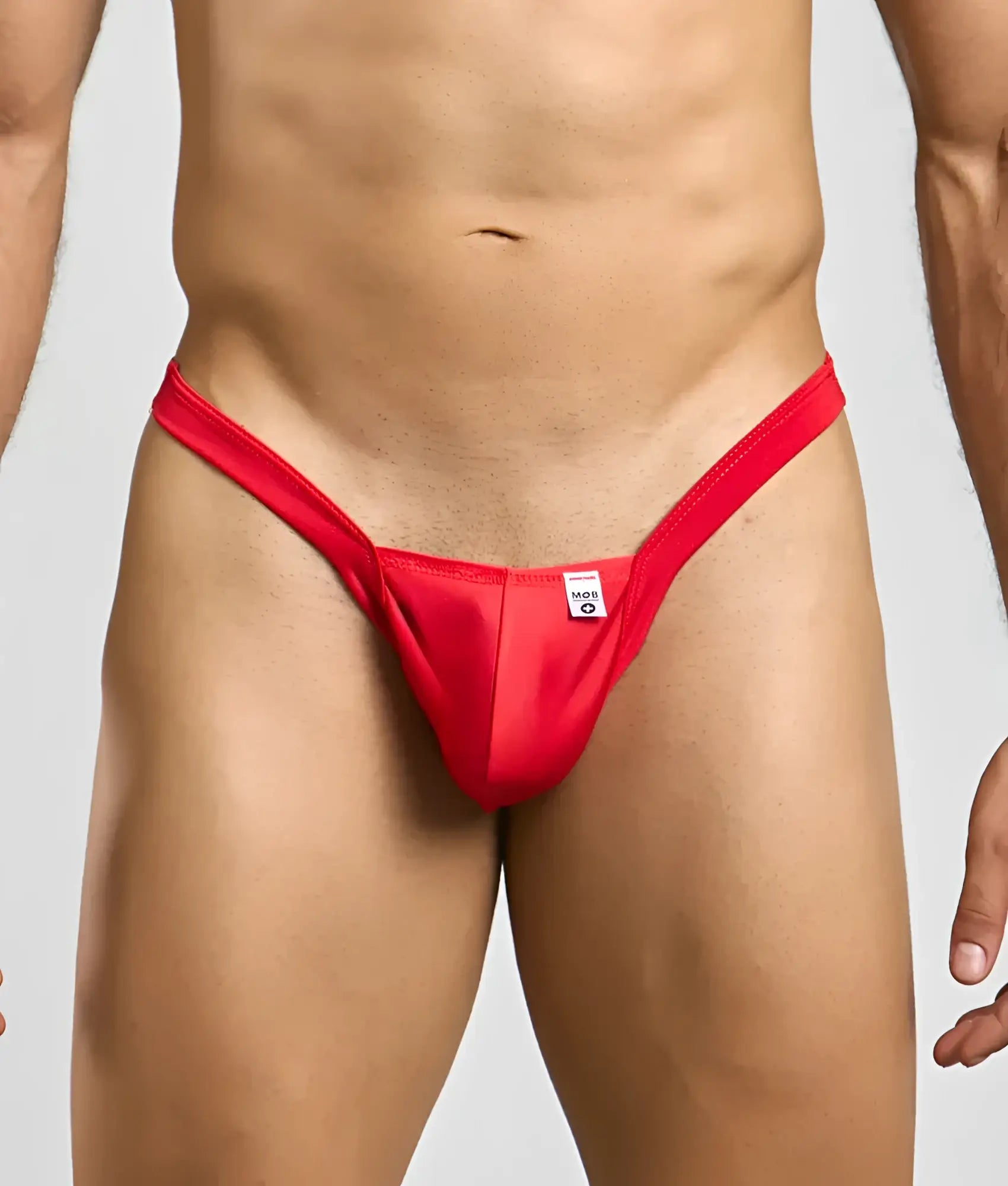 Red thong mob y buns thong with a small white tag at the center front made from soft breathable fabric