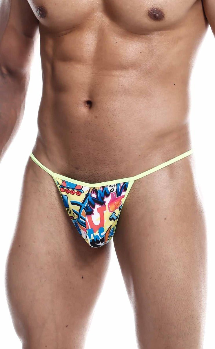 Vibrant yellow mob hipster t thong print with bold graffiti graphics and thin matching elastic waistband front view
