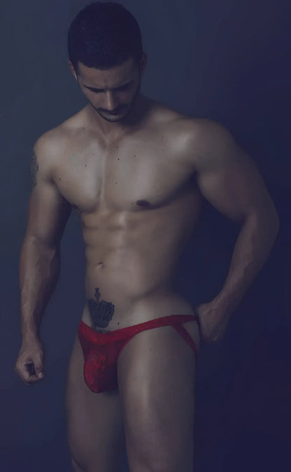 Red lace athletic jockstrap with small embroidered logo on front designed for men’s activewear by mob
