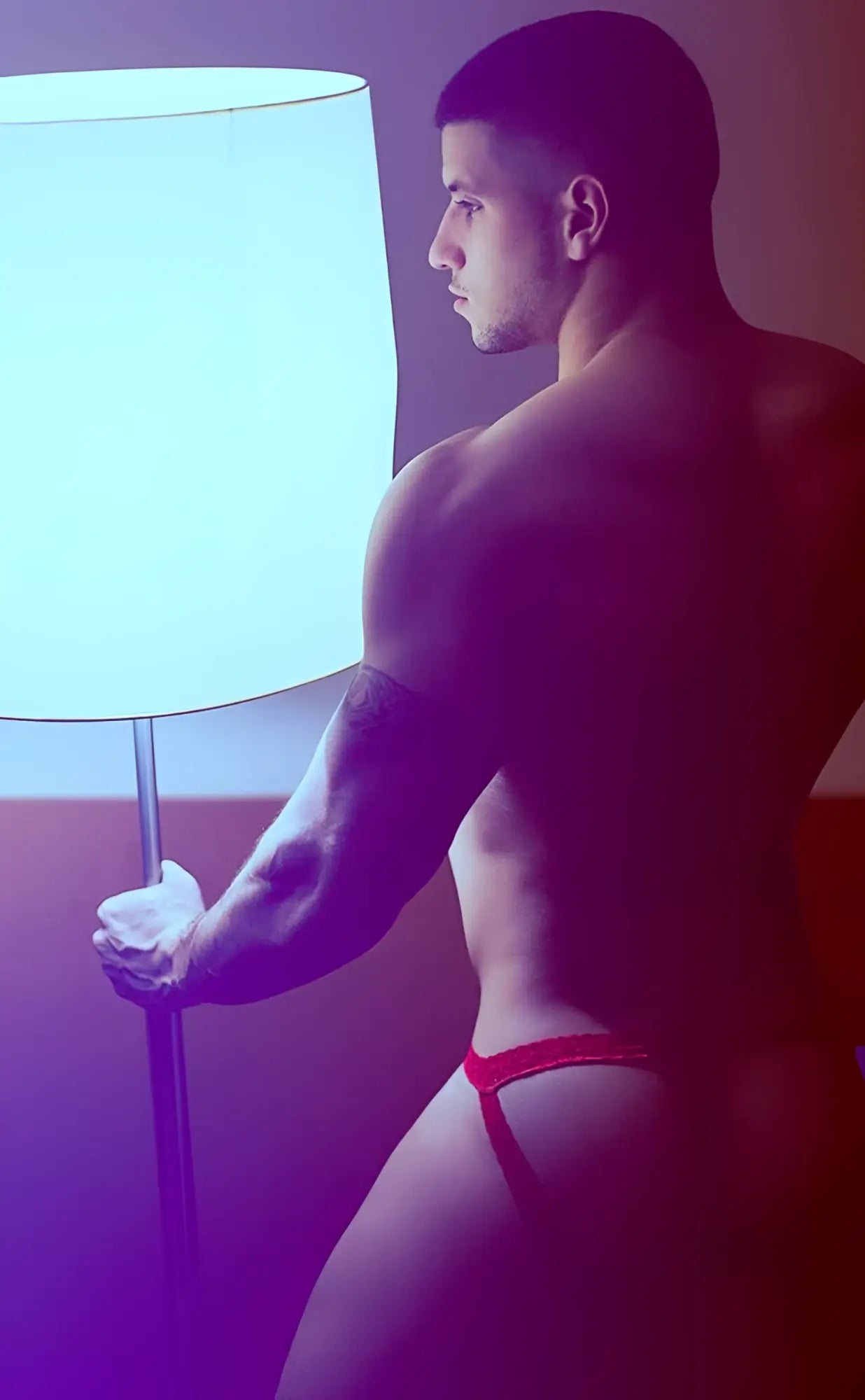 Red thong briefs featuring lace in a men’s jockstrap style by mob shown from the back side