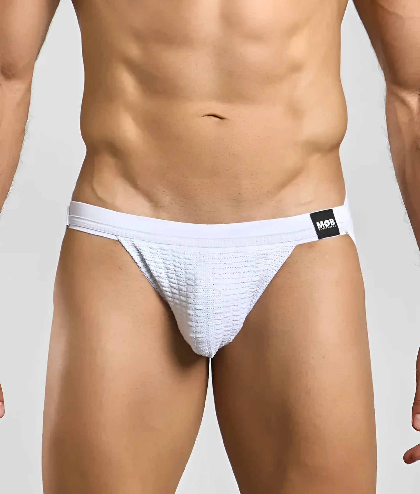 White textured swim jockstrap briefs with black mor brand tag on waistband for comfortable swimming