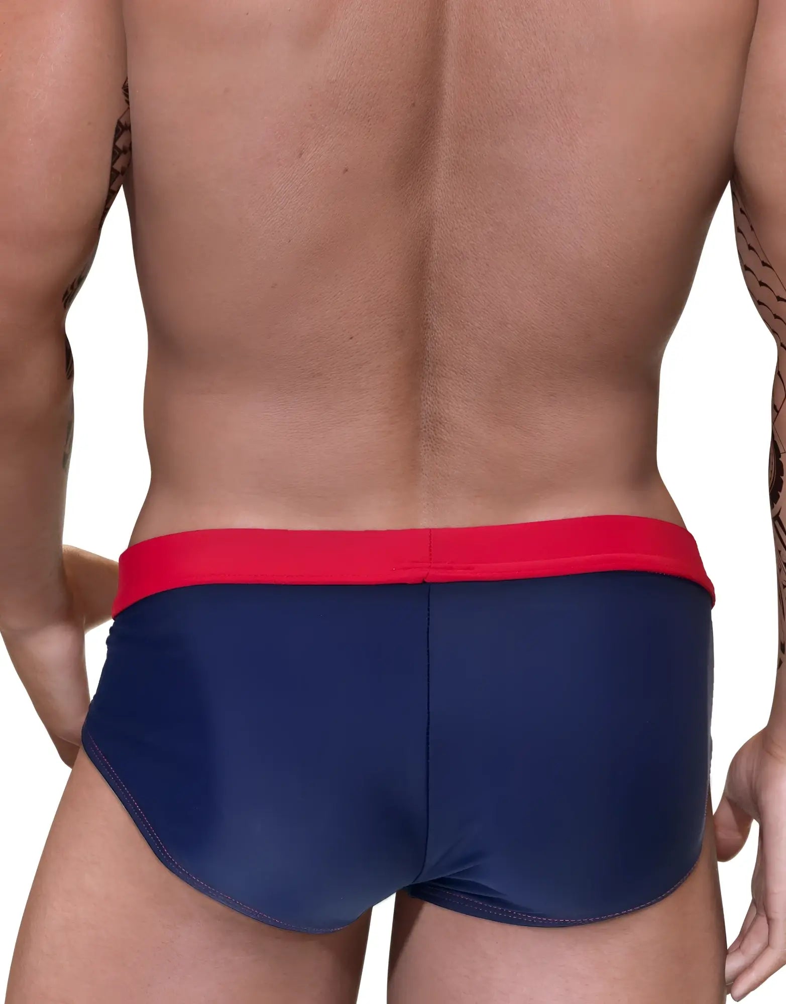 Navy blue swim trunks with bold red waistband featuring a big boy pouch for comfortable beachwear use