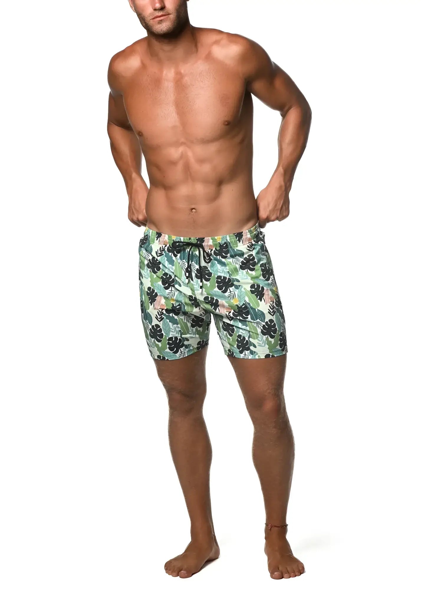 Moritz 6 inch inseam swim short men’s light green and black tropical leaf patterned swim trunks for beach use