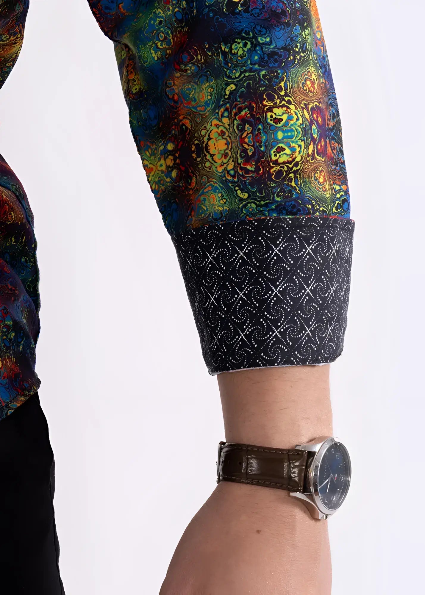 Multicolor patterned l s shirt sleeve in vibrant mandala print with dark navy cuff and intricate white geometric design