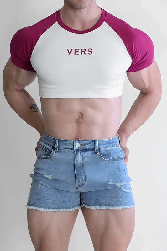 Muscle-fit crop tee in white and magenta raglan style with maroon vers print on chest for versatile wear