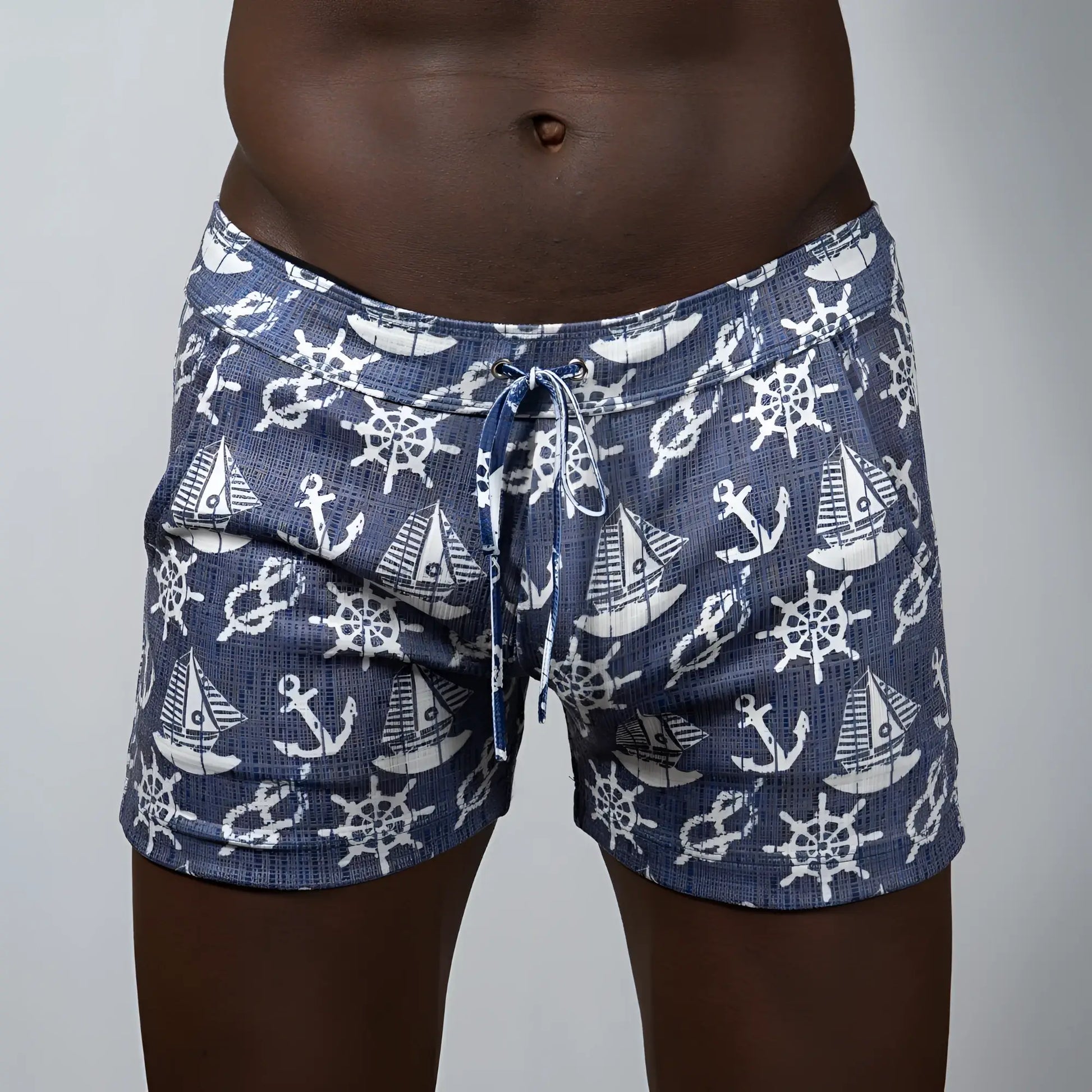 Navy blue nautical linen texture shorts with white anchor sailboat and ship wheel pattern swim trunks