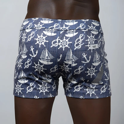 Nautical linen texture shorts in blue featuring white ship wheels anchors and sailboats pattern