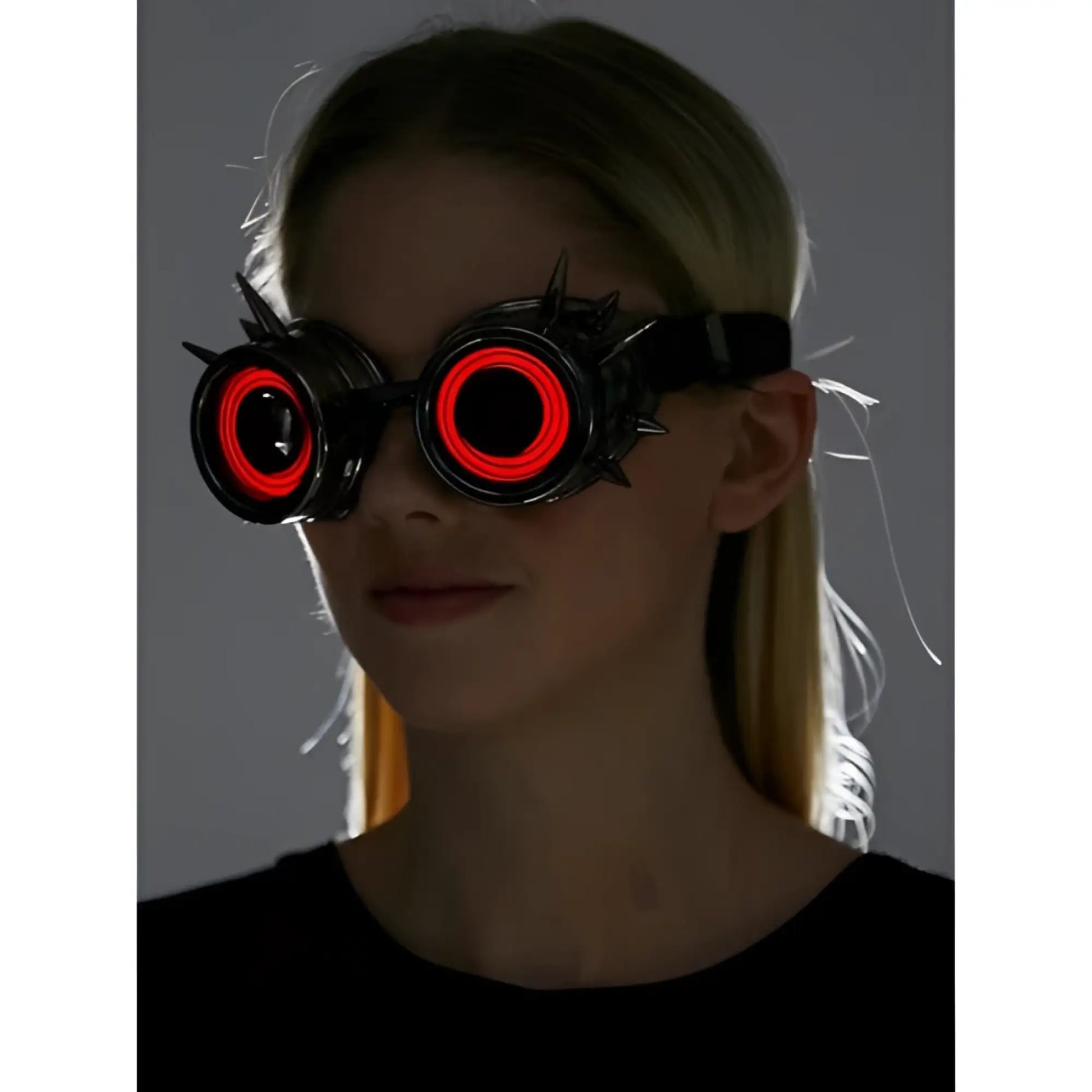 Black spiked neon light up goggles with glowing red circular lights for cosplay or rave events