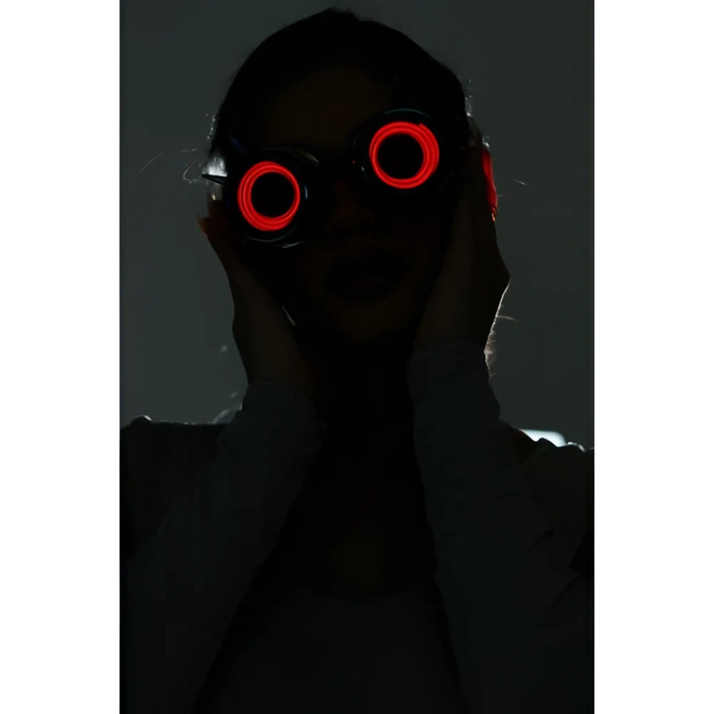 Neon light up goggles featuring red led-lit circular glowing lenses for vibrant nighttime use