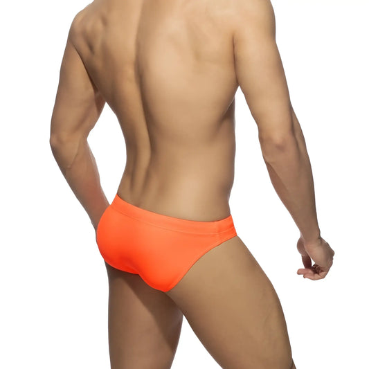 Bright orange neon swim bikini trunks with a smooth form-fitting design perfect for swimming