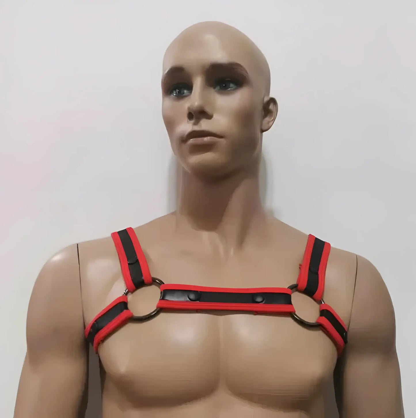 Red and black leather neoprene bulldog harness with metal rings designed for secure and comfortable use