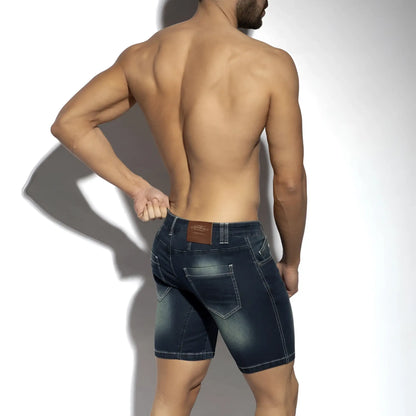 Dark blue denim bermuda jeans shorts with faded wash and stitched pockets showing the back side