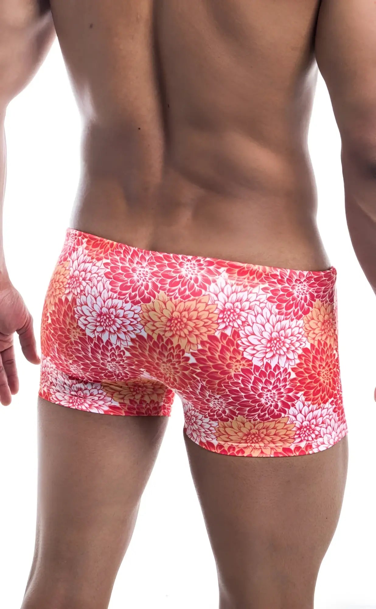 Oceanico Square Cut swim trunks in vibrant coral and white floral pattern with a snug high waisted cut