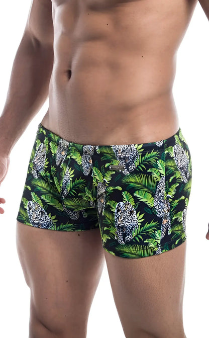 Oceanico square cut men’s swim trunks with vibrant jungle pattern green foliage and spotted leopards on navy background