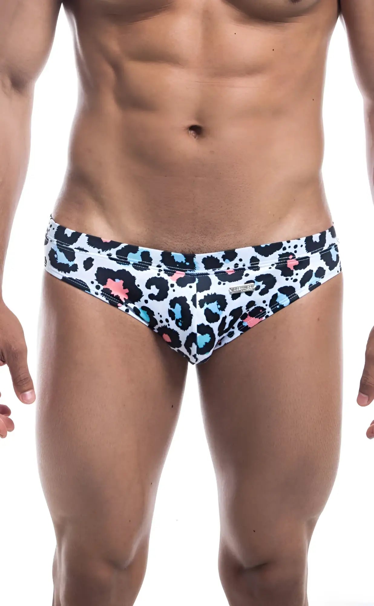 White swim trunks with bold leopard print black spots and bright blue pink accents oceanico swim bikini
