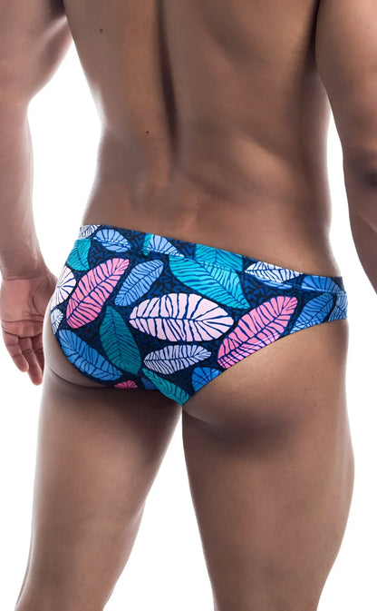 Oceanico swim bikini vibrant tropical leaf-patterned swim trunks in pink teal white on dark blue base