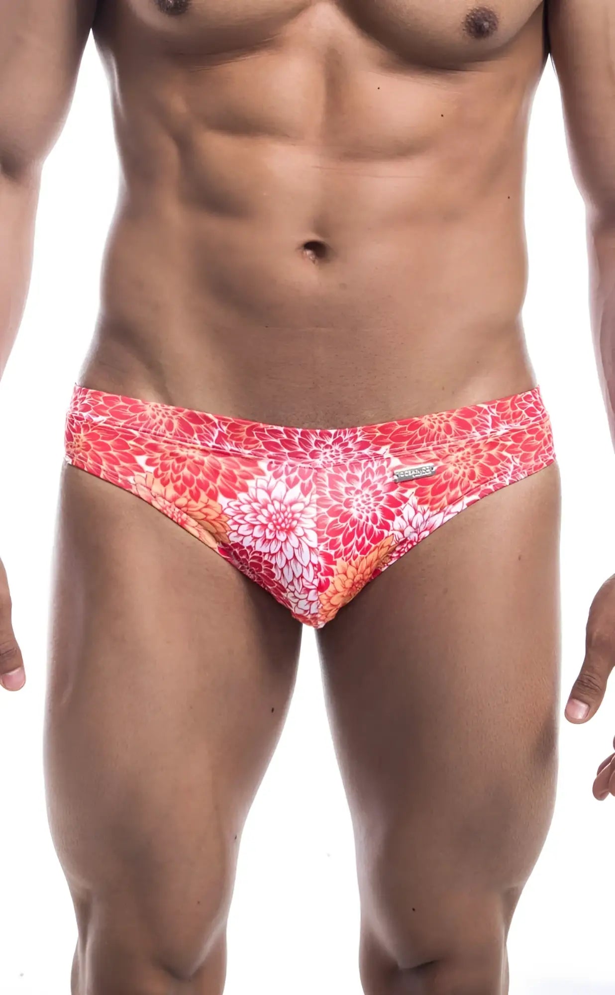 Vibrant coral and white floral patterned men’s swim trunks by oceanico swim bikini for beachwear
