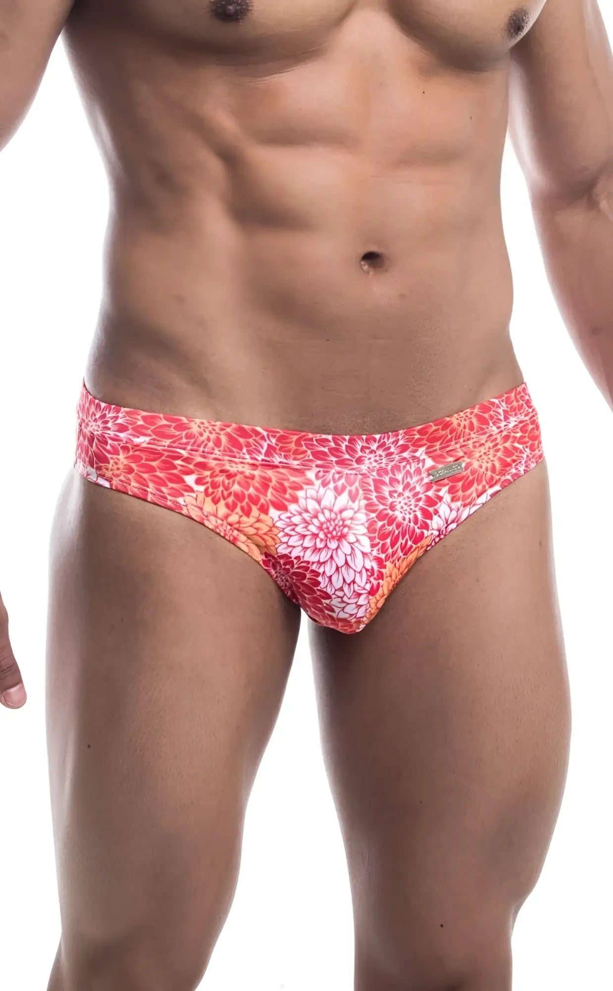 Oceanico swim bikini featuring vibrant coral and white floral-patterned swim trunks with a sleek modern design