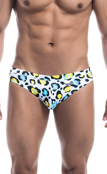 White Oceanico swim bikini trunks with bold colorful leopard print featuring yellow and teal spots for beachwear