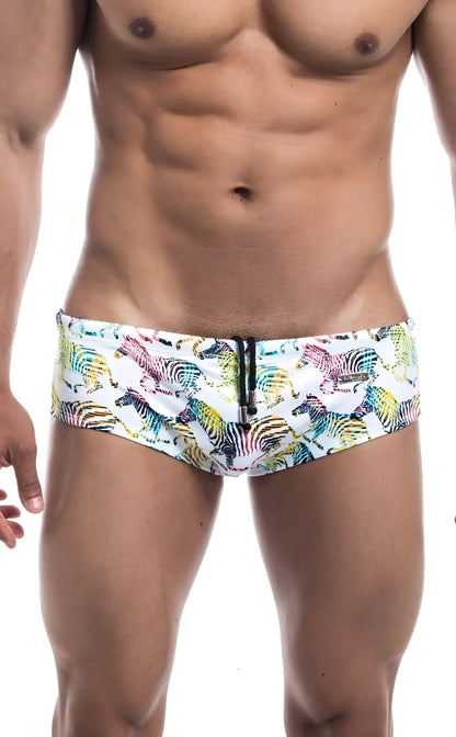 Oceanico swim brief in white with vibrant multicolored zebra pattern and black zipper closure