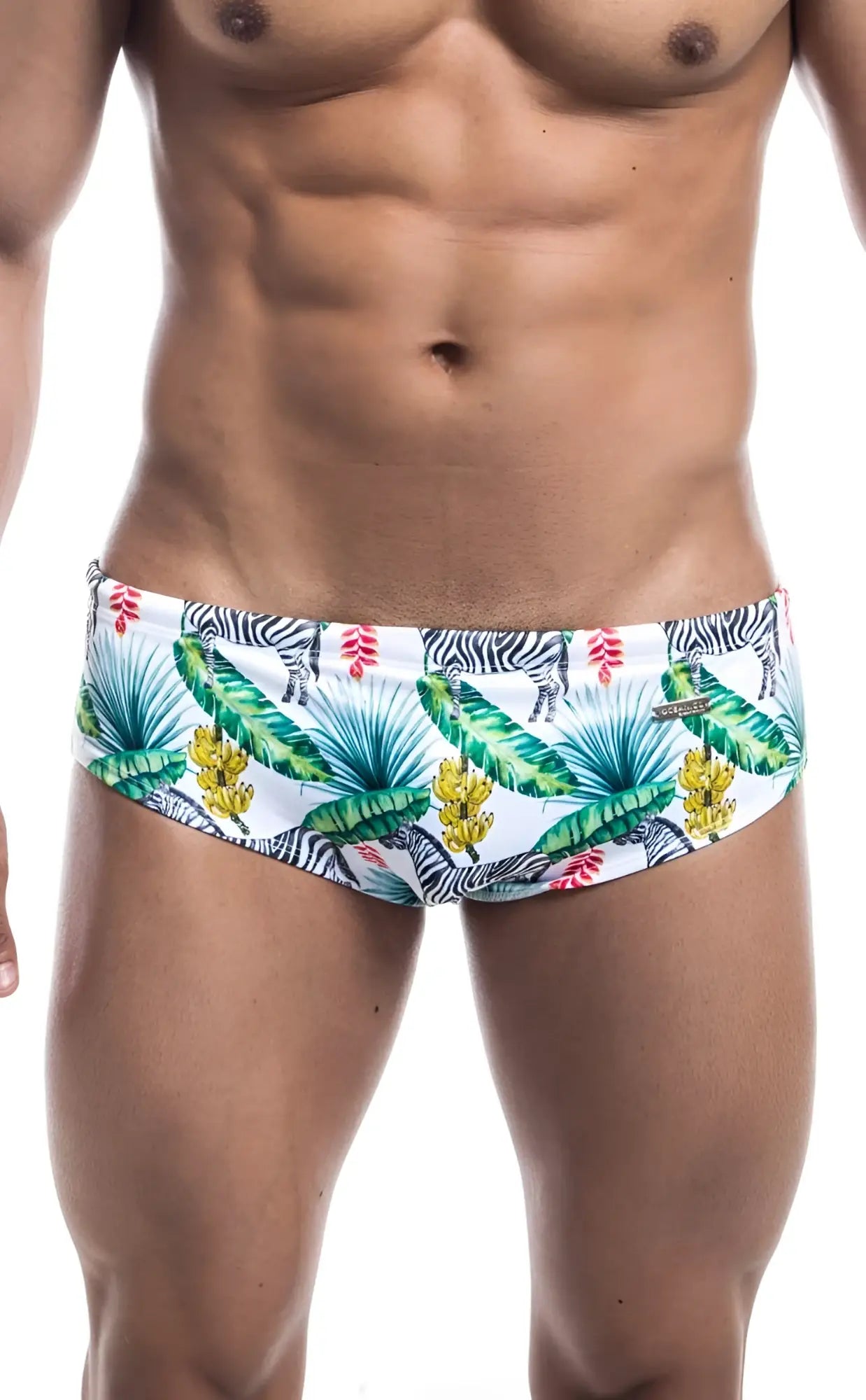 Oceanico swim brief in white featuring a vibrant tropical pattern with palm leaves bananas flowers and zebras
